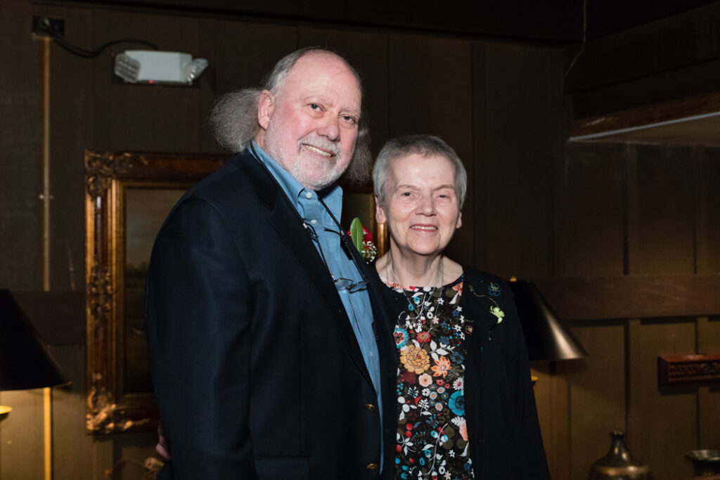 Larry Carius with his wife Kay.  Larry is wearing a blue shirt with sports jacket.  