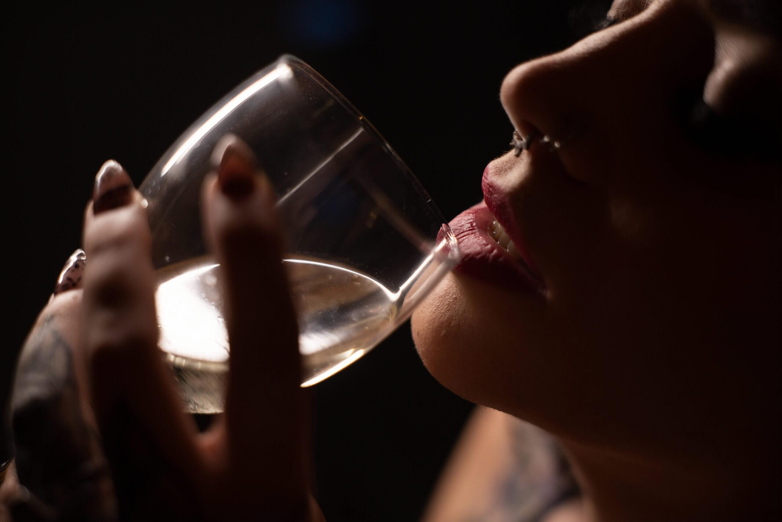 Hand holding a glass of wine.