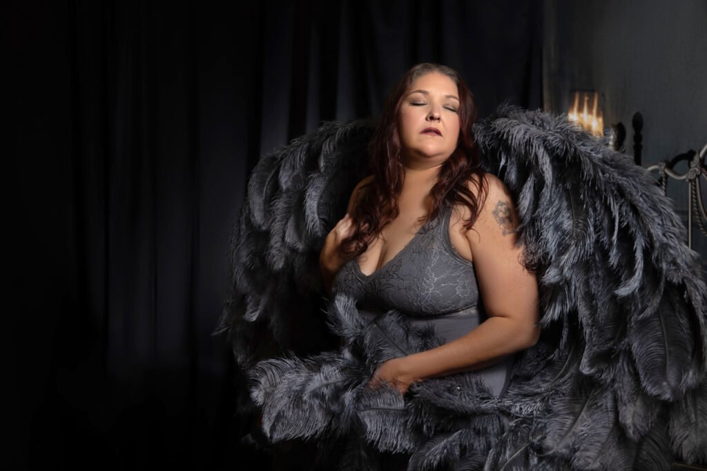 Person with large feathered wings.